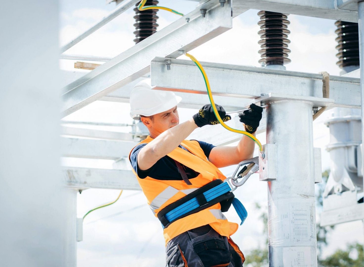 Electrician,In,Protective,Helmet,Working,On,High,Voltage,Power,Lines.